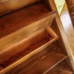 Northwoods cabin stairs with storage