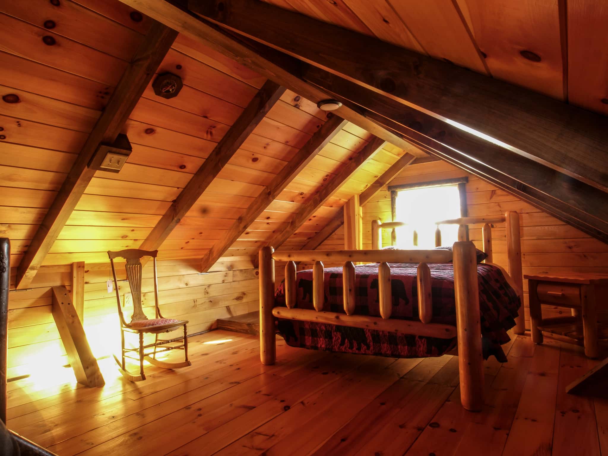 Queen bed frame with bedside table enhances the beauty and elevates the comfort of our cabins and yours!